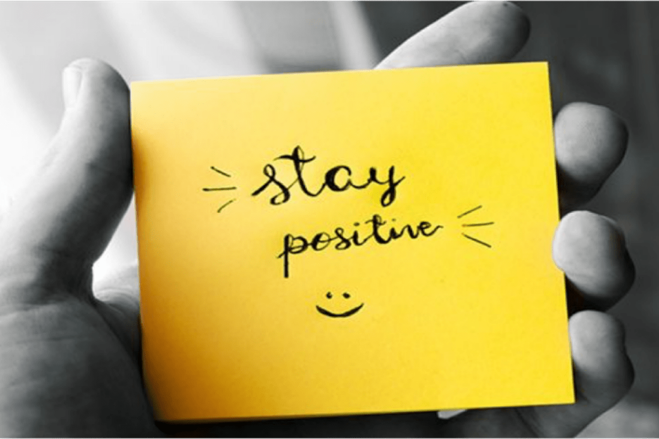 Yellow post-it note saying stay positive